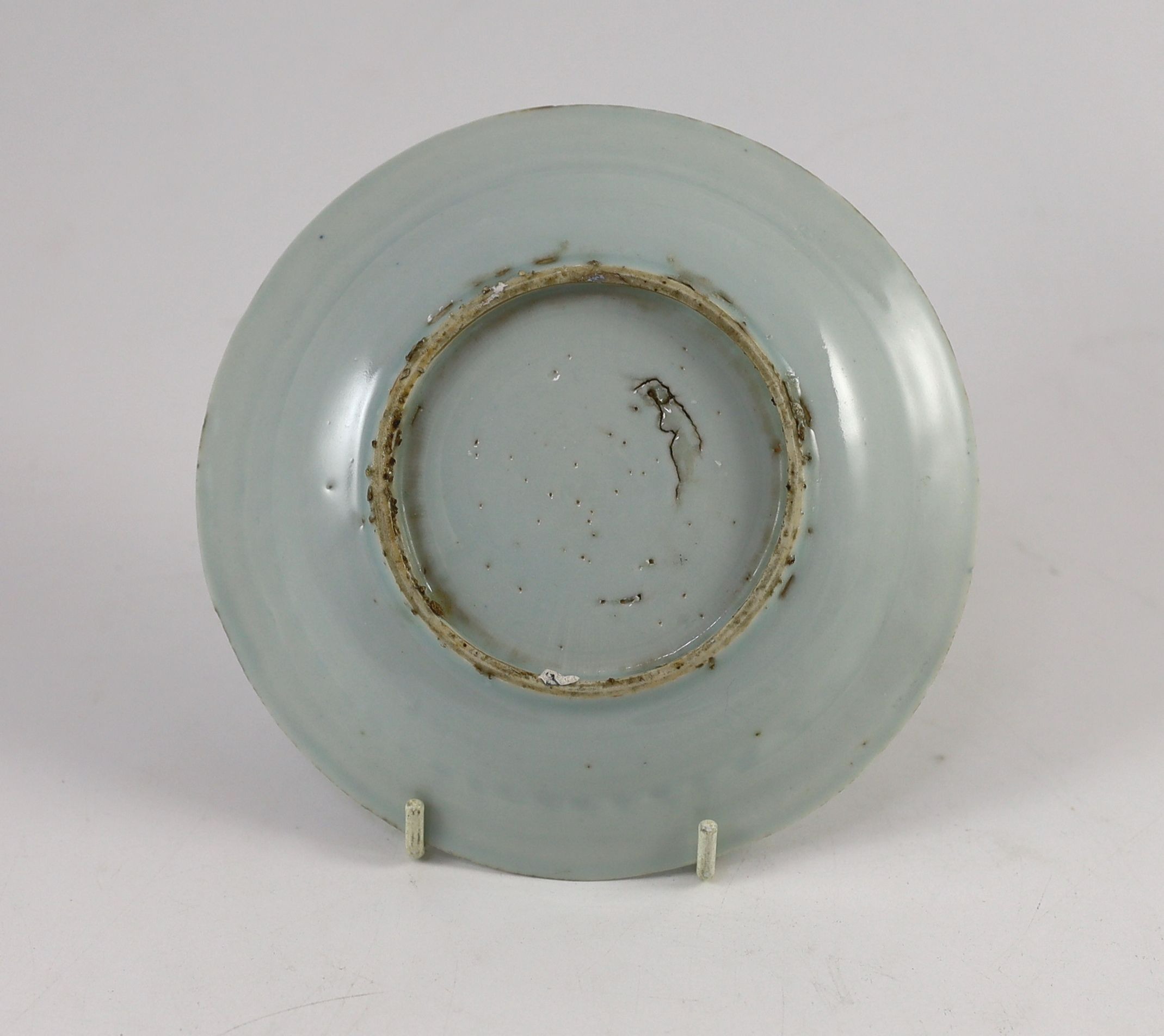 A Chinese blue and white ‘crane and pine’ dish, Transitional period, 15.7 cm diameter